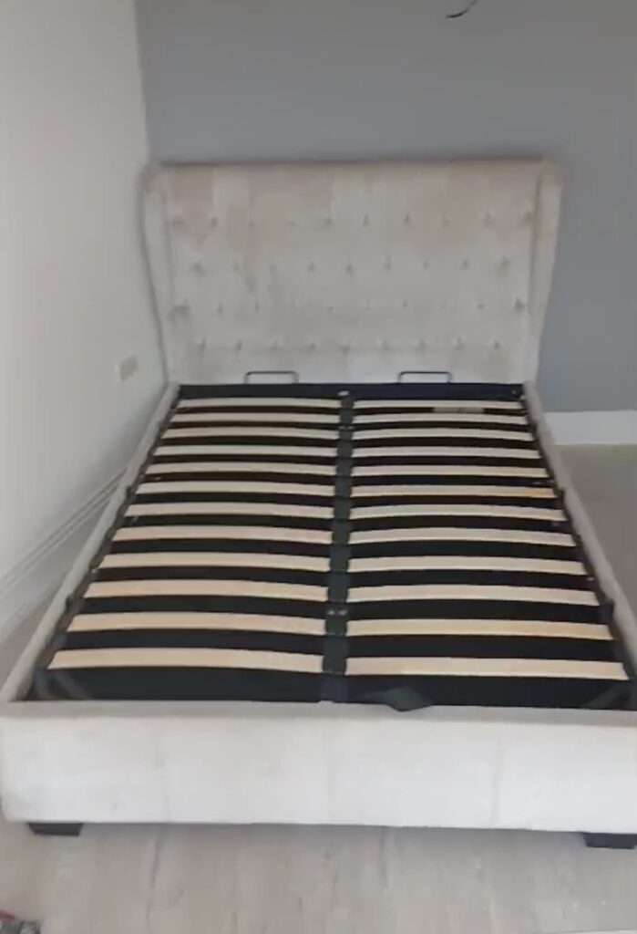 Bed and bedroom furniture being moved by professional removals team in Slough