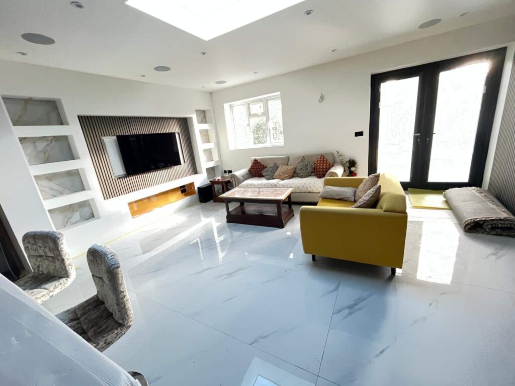 Large sitting room furniture including sofas being moved by removals team in Slough